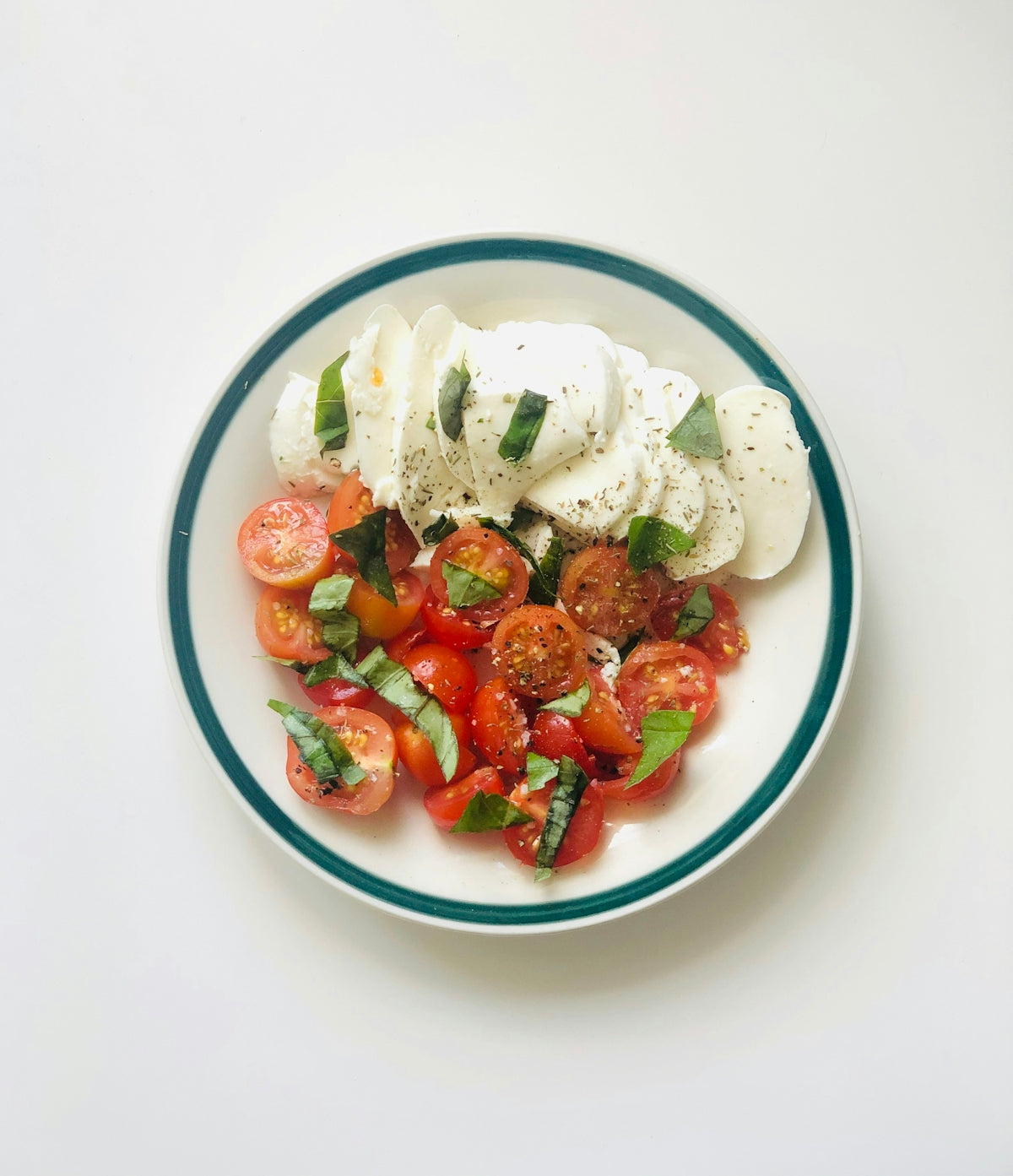 sliced strawberries on white ceramic bowl