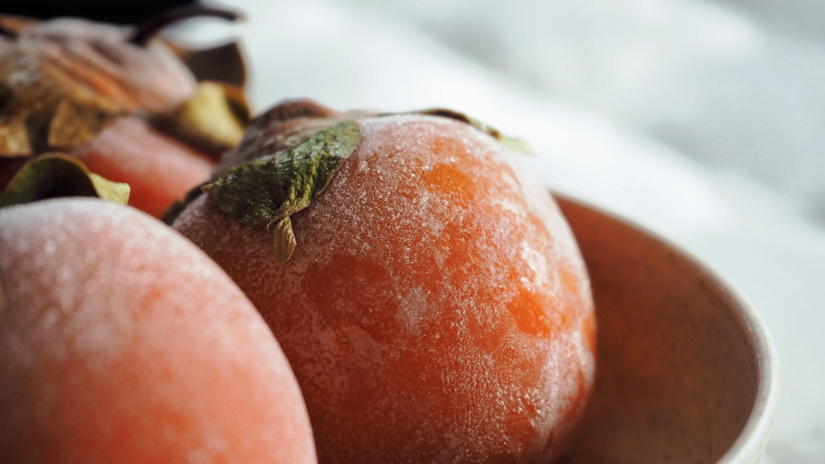 a close up of a bowl of fruit on a table