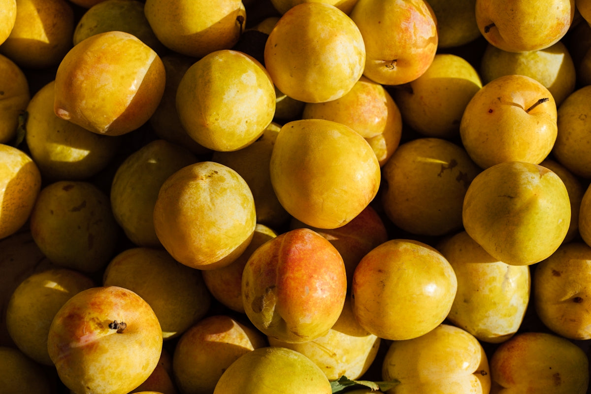 a close up of a bunch of yellow fruit