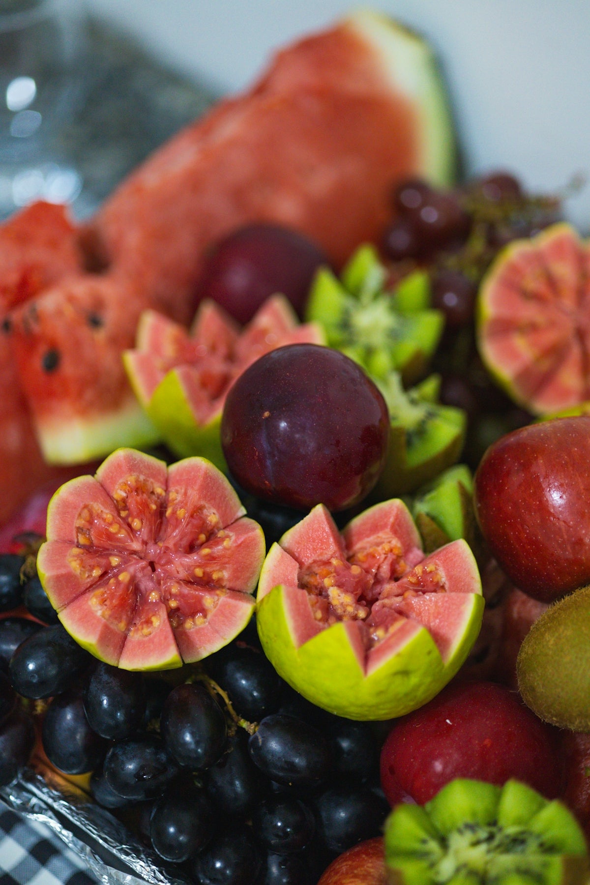 A close up of a plate of fruit on a table